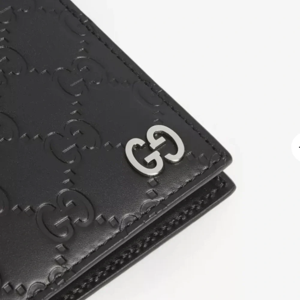 Authentic Gucci Dorian Signature Embossed Leather Bifold Wallet
